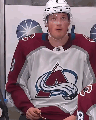 Hockey Player Wearing Bauer Helmet and A Jersey