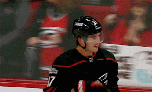 Hockey Player Wearing Helmet Saying SNC