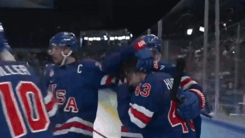 Hockey Player Wearing Number 10 Hugging