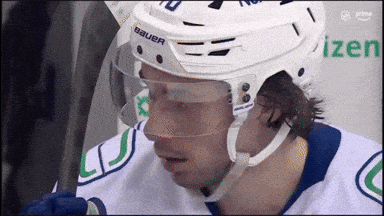 Hockey Player Wearing White Bauer Helmet