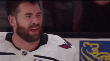 Hockey Player With Beard In White Jersey With Red Eagle GIF