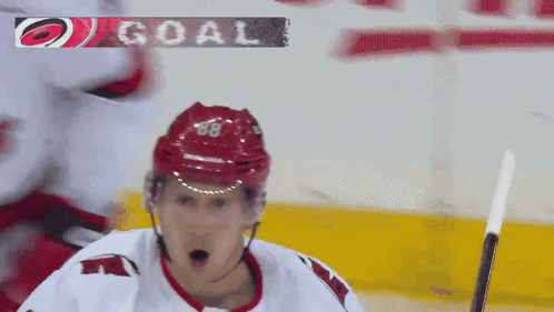 Hockey Player with Red Helmet Number 68