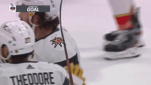 Hockey Player With Theodore on Back