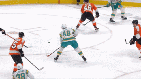 Hockey Players on Ice Before West Ge Ad