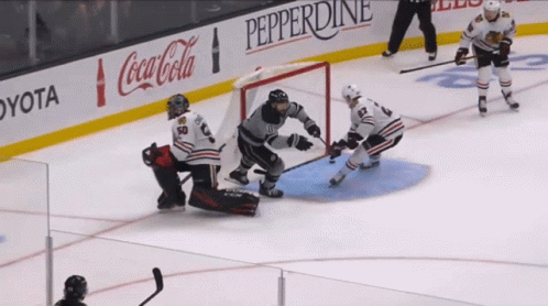 Hockey Players on Ice with Coca-Cola and Pepperdine