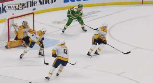 Hockey Players On The Ice With Us Bank And Ecolab Ads GIF