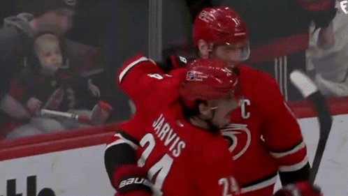 Hockey Players Standing on Rink