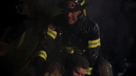 Holding Back Fire Fighter GIF