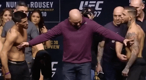 Holding Back Men On Fight GIF