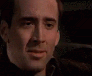Holding In Laugh Nicolas Cage GIF