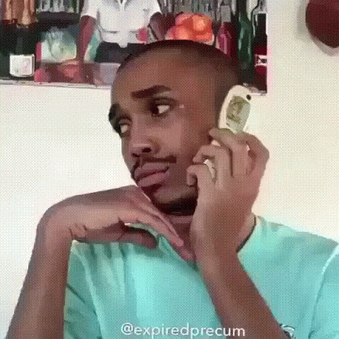 Holding Motorola Flip Phone Saying Ugh It's My Boss