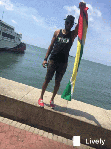 Holding The Flag Of Guyana GIF