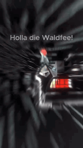Holla Die Waldfee Is Written On A Screen With A Car In The Background GIF