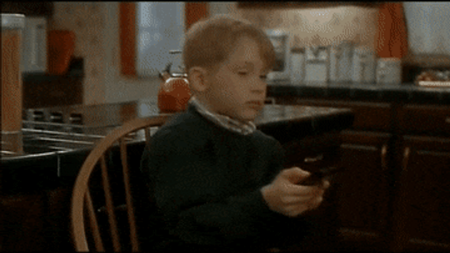 Home Alone Kevin Using Tv Remote GIF