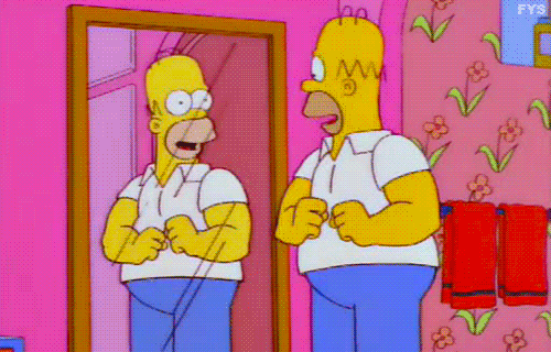 Homer Simpson Flexing Strong Arms In The Mirror GIF