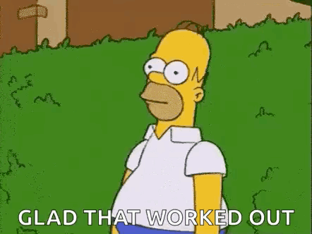 Homer Simpson From The Simpsons Is Standing In A Grassy Field . GIF