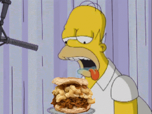 Homer Simpson Is Eating A Mac And Cheese Sandwich GIF