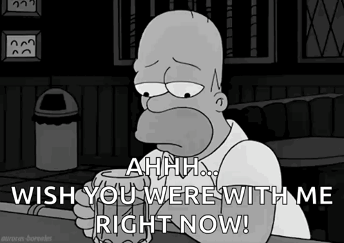 Homer Simpson Is Sitting At A Bar Holding A Beer And Saying " Ahhh Wish You Were With Me Right Now " GIF