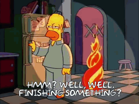 Homer Simpson Is Standing In Front Of A Refrigerator With The Words " Hmm Well Well Finishing Something " Written Below GIF