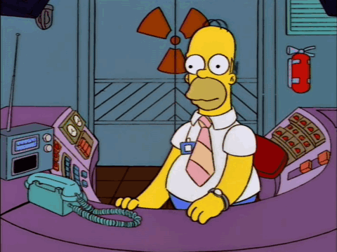 Homer Simpson Talking On Phone Near Fire Extinguisher GIF