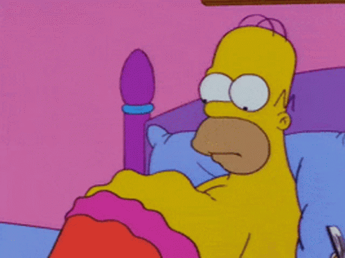 Homer Simpson Laying In A Bed With A Pink Blanket GIF