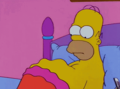 Homer Simpson Lying in Bed with Pink Blanket