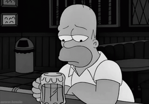 Homer Simpson Sitting at Bar Holding Beer