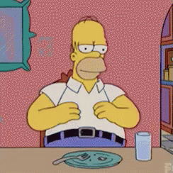 Homer Simpson Sitting at Table