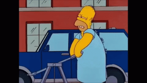 Homer Simpson Standing Next to Blue Car