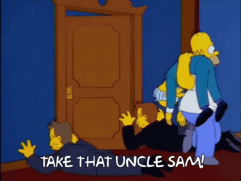 Homer Simpson Standing Next to Man on Floor