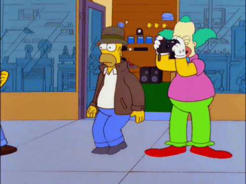 Homer Simpson Taking Photo Of Clown GIF