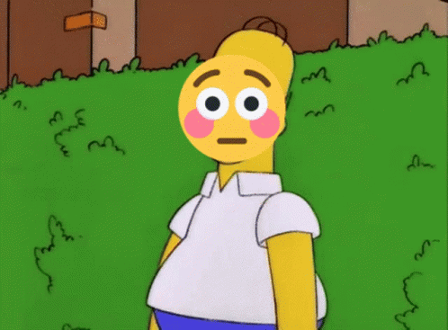 Homer Simpson With A Smiley Face On His Face Standing In The Grass GIF