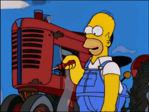 Homer Simpson Working on Red Tractor With Screwdriver
