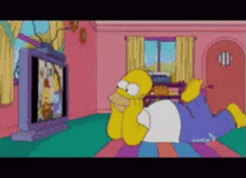 Homer Watching Television Lying In The Floor GIF