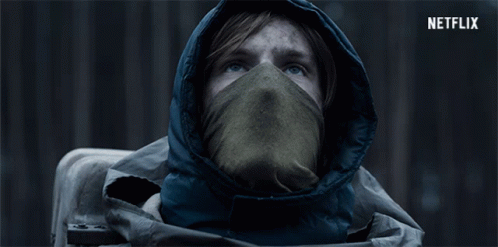 Hooded Person With Scarf and Netflix Logo