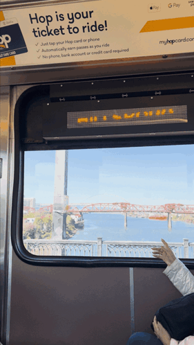 Hop Is Your Ticket To Ride Sign Above Window GIF