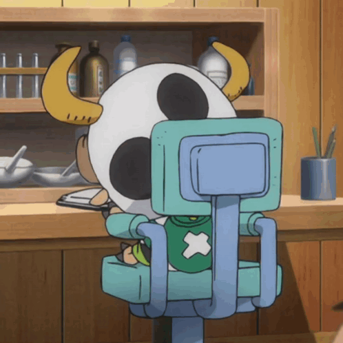 Horned Cartoon Character Sitting In Blue Chair GIF
