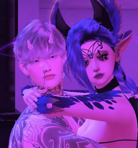 Horned Woman Hugging Tattooed Man