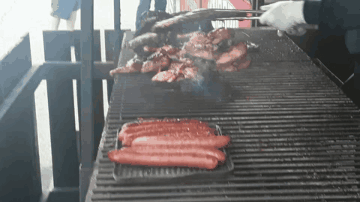 Hot Dogs Cooking on Grill