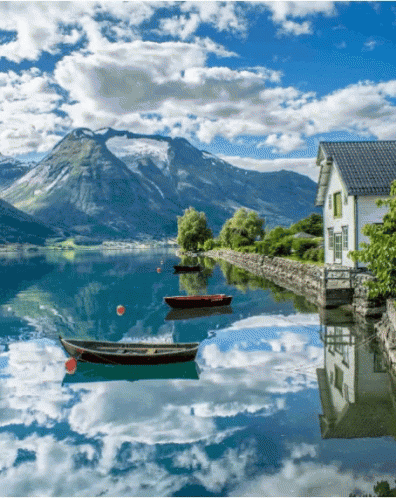 House on Lake Shore With Boats