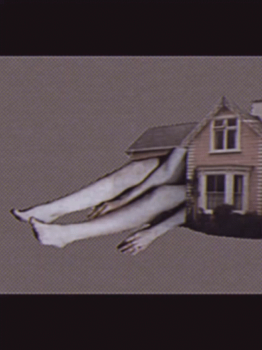 House With Person's Legs Coming Out