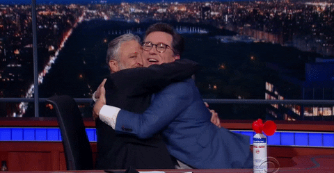 Hugging Happy Stephen Colbert GIF