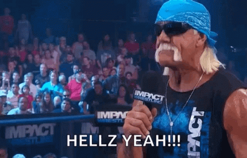 Hulk Hogan Is Holding A Microphone In Front Of A Crowd And Says Hellz Yeah ! GIF