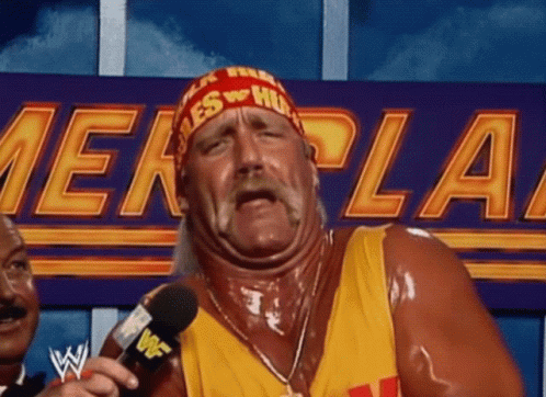 Hulk Hogan Is Talking Into A Microphone In Front Of A Sign That Says ' Wwe ' On It . GIF