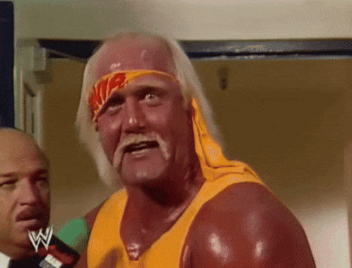 Hulk Hogan Is Wearing A Yellow Shirt And A Headband With A Wwe Logo On It GIF