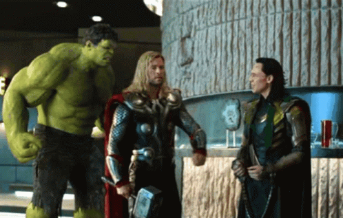 Hulk Thor And Loki Standing Next To Each Other In A Room GIF