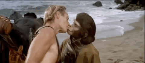 Human Monkey Kissing A Man GIF