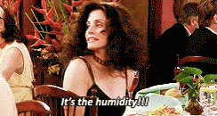 Humid Woman Holds Its Hair GIF