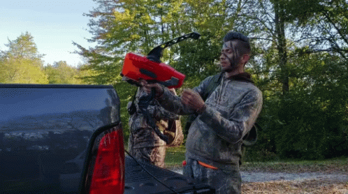 Young Guys Preparing Hunting Gears GIF