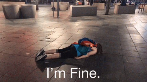 I'm Fine Lay On The City Street GIF